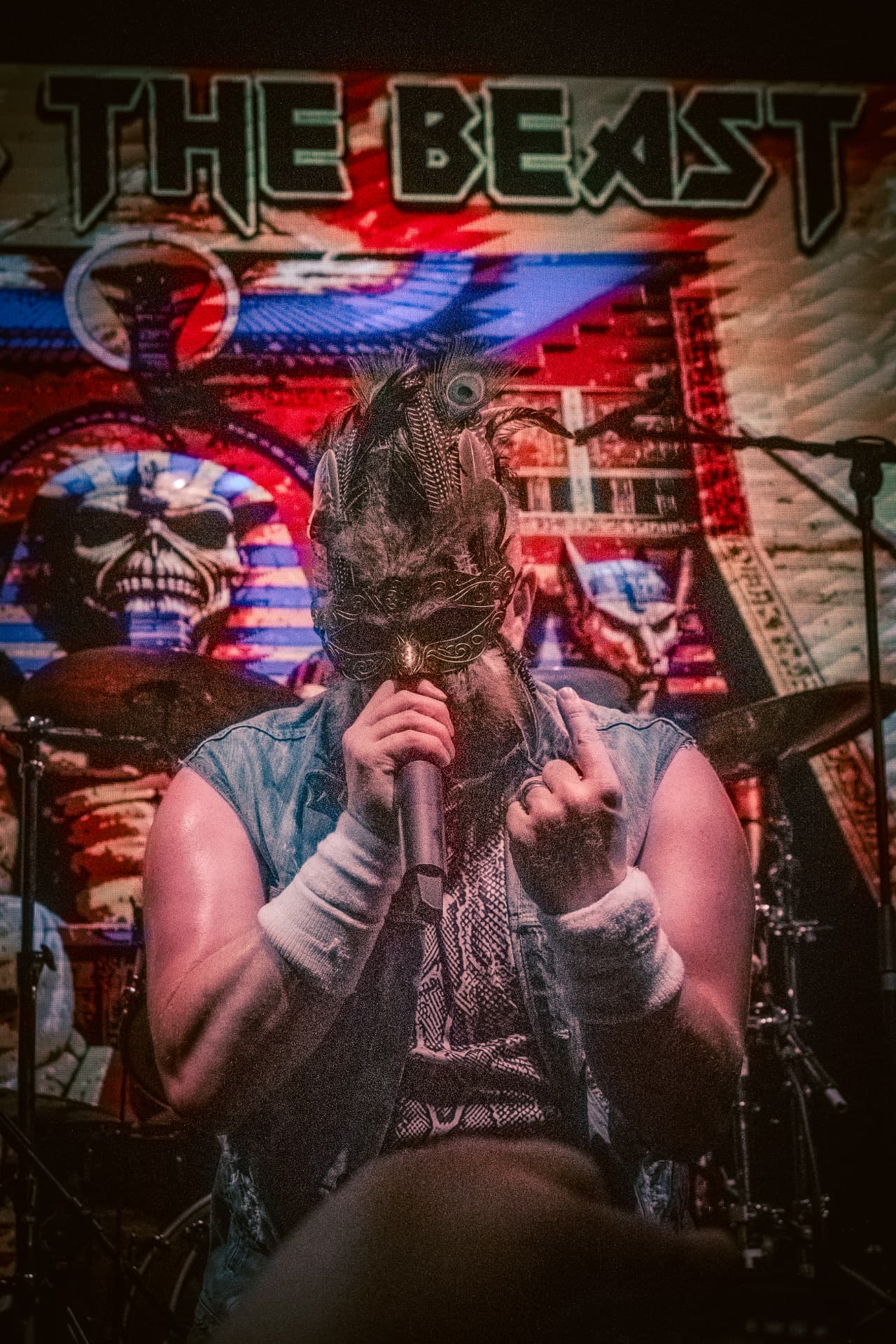 Run to the Beast performing at The Button Factory, Dublin — the vocalist singing in a feathered mask